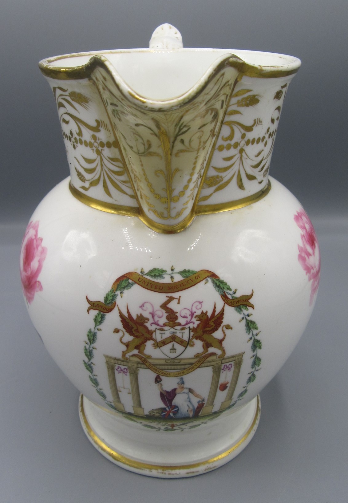 An English porcelain jug, late 18th/early 19th century, inscribed 'United Society of Plasterers,