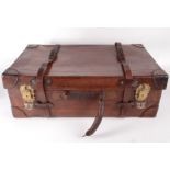 A brown leather suitcase, early 20th century, with brass locks inscribed '6 Levers Asli', height 24.