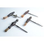 Four steel corkscrews, each with a turned wood handle and brush.