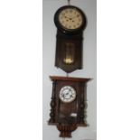 A Victorian walnut wall clock, height 50cm and an oak cased wall clock by Jose Bessey, Barcelona,