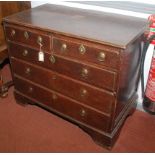 A George III oak chest of drawers, with two short and three long drawers on bracket feet, height 79.
