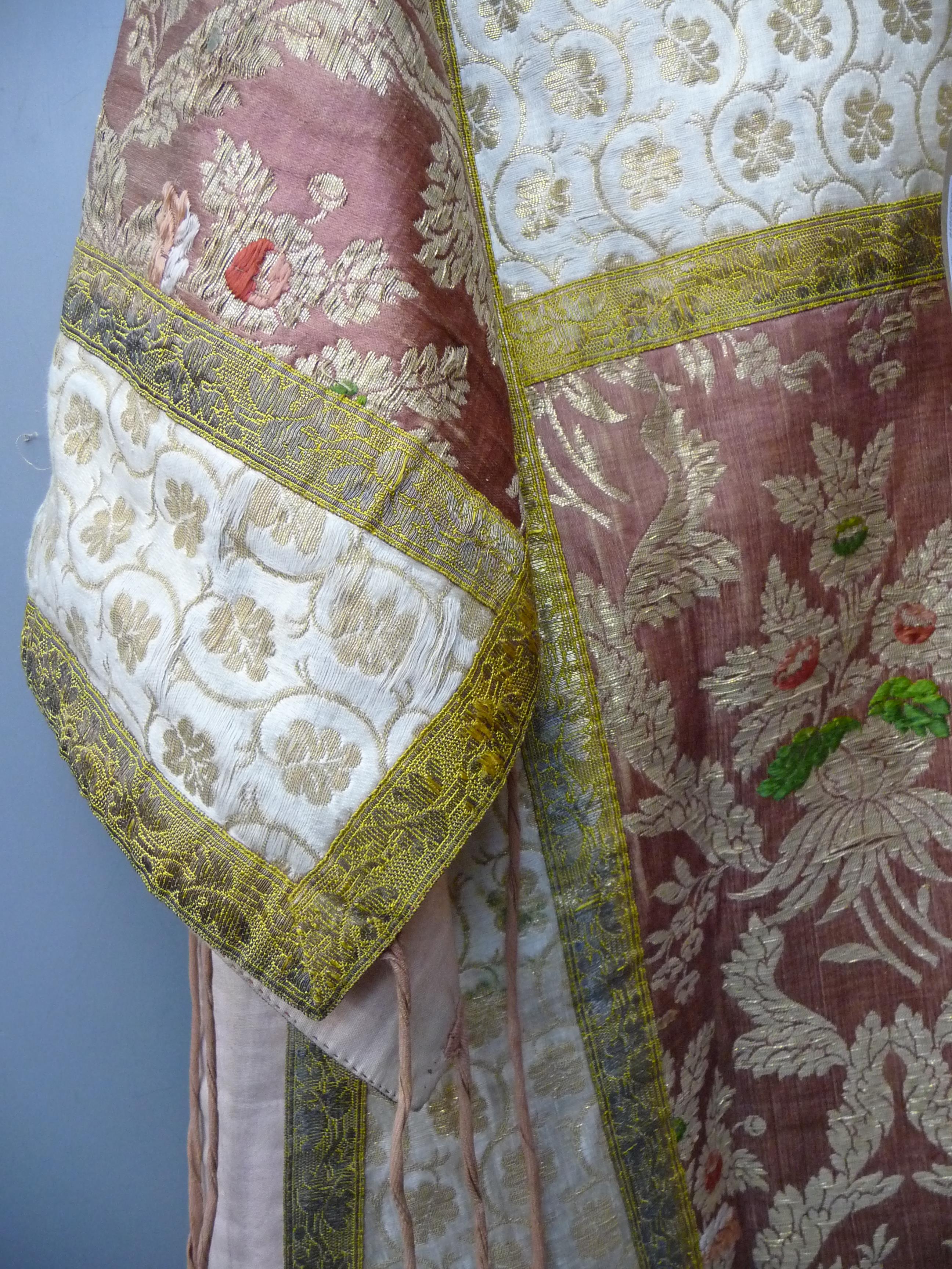 An eastern silk and metal thread over tunic, decorated with floral sprays and leaves, length 101cm. - Image 8 of 8