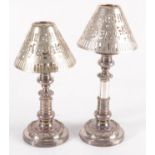 A pair of silver plated telescopic candlesticks with later white metal pierced shades,
