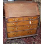 An inlaid oak bureau, early 19th century,