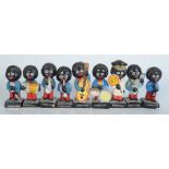 A set of eight Robinsons golliwog band figures, height of tallest 7.