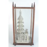 A Chinese bone model of a pagoda with figures on a pavilion, late 19th century,