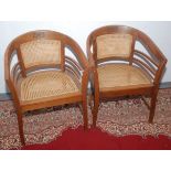 A pair of Arts and Crafts tub armchairs,