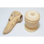 A 19th century bone stick finial in the form of a greyhounds head with glass eyes,