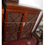 A mahogany bookcase, early 20th century, with a pair of astragal glazed doors and bracket feet,