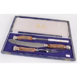 A silver plated and antler handled three piece carving set, by Mappin & Webb, Sheffield,