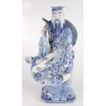 A Chinese blue and white porcelain figure of an immortal, 19th century, height 34.5cm, width 18cm.