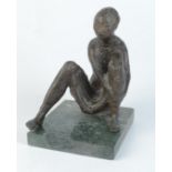 A bronze figure of a seated woman, signed 'Szegedi', on a green marble square base, height 18cm,