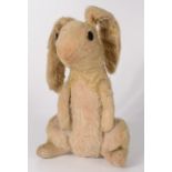 A toy rabbit, with button eyes, love worn, height 31cm.