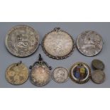 Ten silver coins, some mounted.