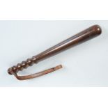 A wooden police truncheon, with turned handle and leather strap, length 38cm.