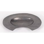 An oval pewter barber's bowl, 19th century, with touchmarks to underside, 22 x 28.5cm.