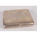 A Russian silver snuff box engraved to represent a bank note, 7 x 5.5 cm, weight 73 g.