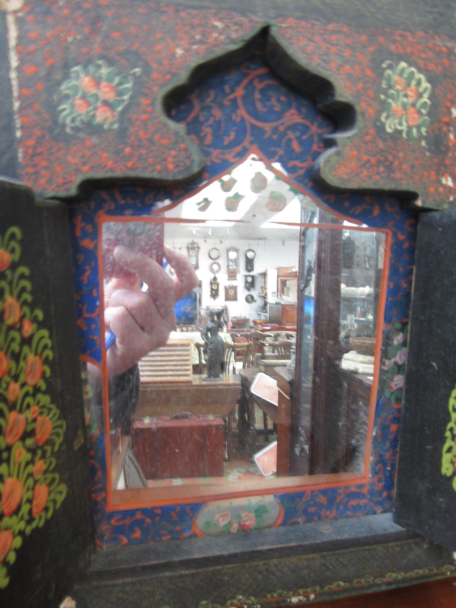 A Persian wall mirror, in a painted wood cabinet with a pair of doors decorated with figures, - Image 6 of 9