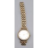 An Everite gold cased wristwatch on 9ct gold bracelet. Condition report: Weight 17.