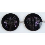 Two silver mounted 6cm verre églomisé disc pendants by Frances Federer one showing a butterfly and