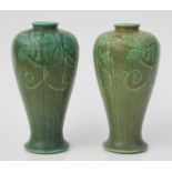 A pair of Pilkington baluster vases, each with leafy vine decoration, impressed 3063, height 22cm.