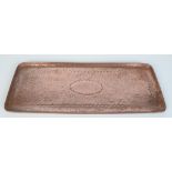A Newlyn hammered copper rectangular tray, impressed 'Newlyn', length 43.4cm, width 17.5cm.