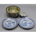 A pair of Chinese blue and white plates, 18th century, decorated with river scenes, diameter 16.