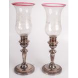 A pair of silver plated candle holders by Matthew Boulton,
