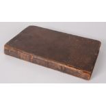 A leather bound book, entitled 'A Discourse of the Paftoral Care', dated 1692, 19.4 x 11.9cm.