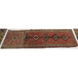 A North West Persian runner, the madder field with eight polychrome linked medallions, with guls,