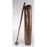 A tribal wooden butter churn, late 19th century, possibly African, complete with its plunger,