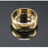 A large 9ct gold band, 12g.