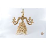 A continental porcelain six branch candelabra, with flower encrusted decoration, height 43cm.