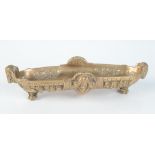 A continental gilt bronze pen holder, 19th century, height 5.8cm, length 25.5cm, width 9cm.