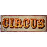 A rectangular painted wood circus sign, 43 x 122cm.