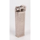A Dunhill Unique Paris silver gas lighter, height 64mm, with fabric textured finish.
