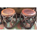 A pair of Chinese hardwood circular stools, height 45.5cm, diameter of seat 31cm.