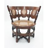 A Burgomaster hardwood chair, 18th/19th century, the back with oval rattan panels and seat above,