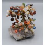 A gemstone and amethyst model of a tree, height 15cm, width 13cm.