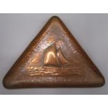 A Newlyn copper triangular tray, decorated with a Mounts Bay lugger, impressed mark, 12 x 16cm.