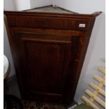 A George III oak and mahogany crossbanded hanging corner cupboard,