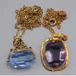 A gold seal pendant on gold chain and a high purity gold amethyst pendant.