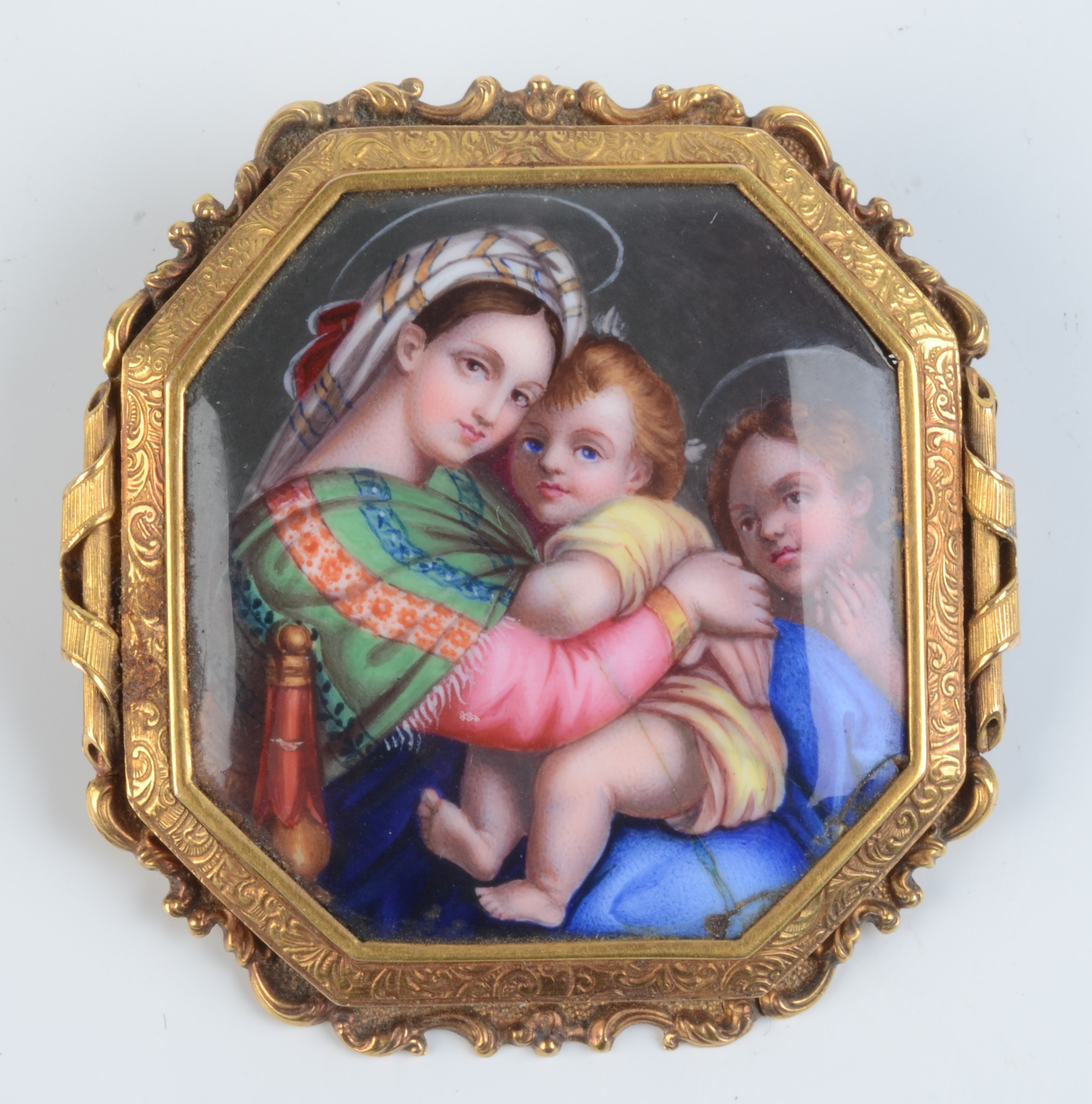A good Victorian high purity gold mounted brooch set within an enamelled panel of the Madonna Della