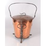 An Arts and Crafts hammered copper log bucket,