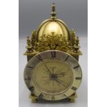 A Swiza 8 miniature brass lantern style clock, height 13cm, diameter of dial 7.2cm.