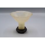 A Chinese translucent pale celadon jade Ming style stem cup, 19th century,