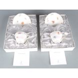 Two contemporary Meissen cups and saucers, boxed, with certification.