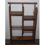 A folding oak butlers tray stand, 19th century, with bobbin turned legs and stretchers,