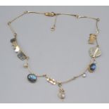 A contemporary 9ct gold Arts and Crafts necklace set with labradorite and moonstones makers mark