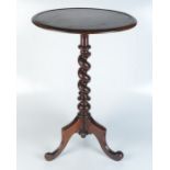 A Victorian mahogany tripod table, the circular top on a barley twist stem and downswept supports,